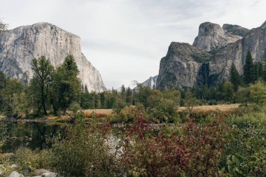 Scenic panoramic view of famous Yosemite Valley with El Capitan rock . High quality photo clipart