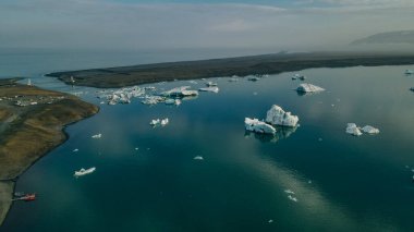 Aerial drone panorama of famous lake Joekulsarlon glacial lagoon and diamond beach with its icebergs. High quality photo clipart
