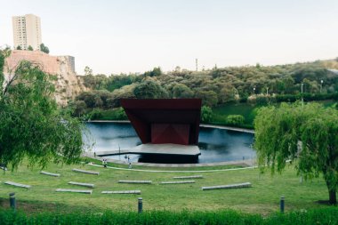 La Mexicana, Santa Fe, Mexico City - april 2023, modern urban park with articicial lake and red auditorium. High quality photo clipart