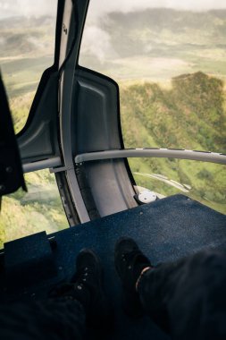 inside the cockpit of a helicopter in hawaii. High quality photo clipart