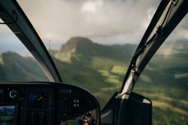 inside the cockpit of a helicopter in hawaii. High quality photo clipart