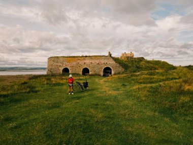 Lindisfarne Castle on the Northumberland coast, England . High quality photo clipart