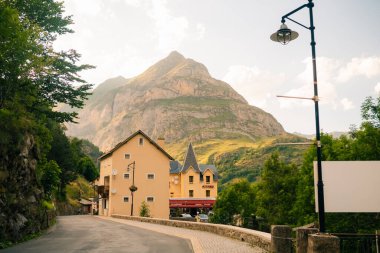 Little village with big mountains in the background in Gavarnie, France - september 12th 2023. High quality photo clipart