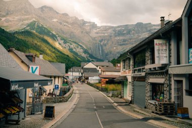 Little village with big mountains in the background in Gavarnie, France - september 12th 2023. High quality photo clipart