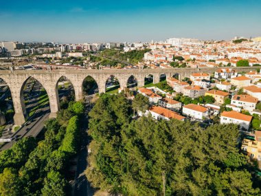 Beautiful aerial view to old historic aqueduct in central Lisbon, Portugal. High quality photo clipart