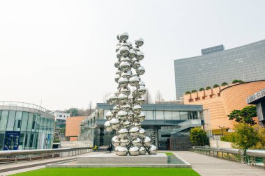 Hannam-dong, Yongsan-gu, Seoul, South Korea - August 23, 2023 Summer view of metal bead statue Tall Tree and the Ey made by Anish Kapoor . High quality photo clipart