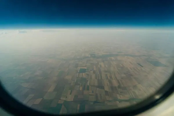 stock image farm fields from airplane window. High quality photo