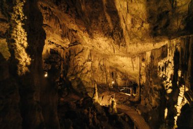 Landscape View Of The Beautiful And Amazing Stalactites On The Trails Of Postojna Cave Park, Postojna , Slovenia. High quality photo clipart