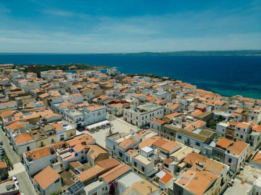 Aerial view of little town of Sant'Antioco houses at sunrise in italy. High quality illustration clipart