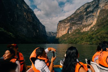 Tourists exploring nature in Canyon del Sumidero in Chiapas, Mexico - may 2 2024. High quality photo clipart