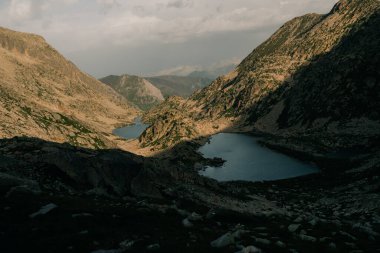 Mountain lakes in Posets Maladeta national park, Vielha valley in Spanish Pyrenees, GR11 hiking trail, Europe. High quality photo clipart