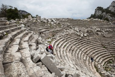 Ruined gymnasium and baths building in Termessos. Ruined ancient city in Antalya province, Turkey. High quality photo clipart