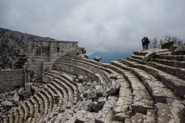 Ruined gymnasium and baths building in Termessos. Ruined ancient city in Antalya province, Turkey. High quality photo clipart