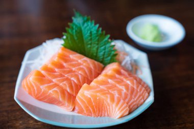 Japan raw salmon slice or salmon sashimi in japanese style. Salmon sasimi on disc.