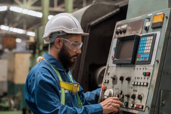 Staff or technicians are checking the operation of the old machine. Young man operation of the old machine via the remote.