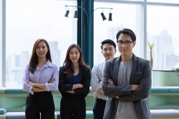 Business consultation, business team. Employees and executives are standing confidently looking at the camera.
