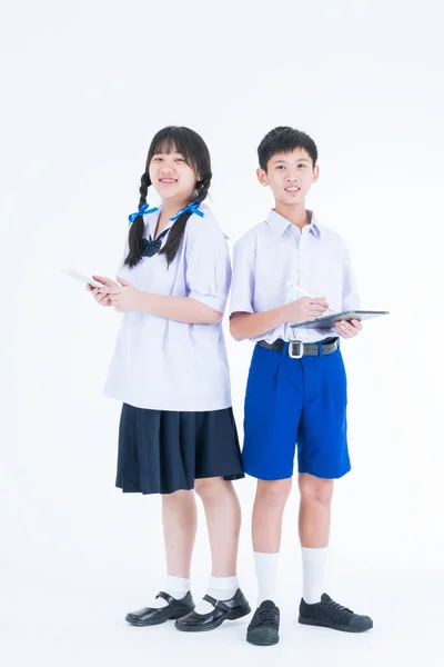 学校に戻る タイの学生 カラフルな文房具を持つ2人のアジアの笑顔の学校の子供 タブレット付きの学生 — ストック写真
