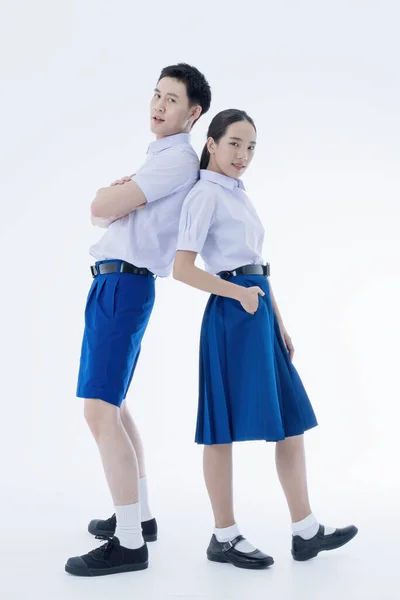 Thai student Uniform. Two Asian students standing together. Asian young couple in students uniform on white background.