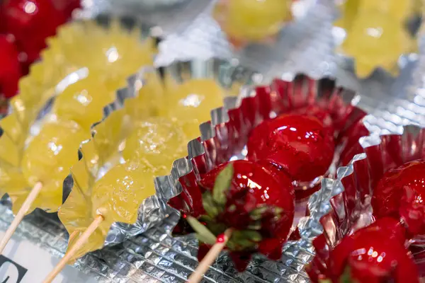 stock image Strawberries coated with sugar. Tanghulu traditional Chinese and Asian hard caramel coated fruit.