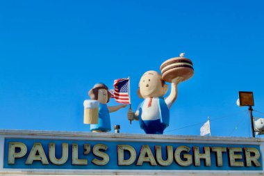 Coney Island, NYC, USA - August the 19th of 2022: Detail of iconic dolls at Paul's daughter dinning, classic C.I. boardwalk location that has been serving food and beverage for more than six decades. clipart