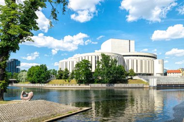 Bydgoszcz, Poland - June 22, 2022: Famous Opera Nowa, modern theatre in the historical district in Bydgoszcz, Poland. Beautiful view of the Mill's Island, tourist landmark