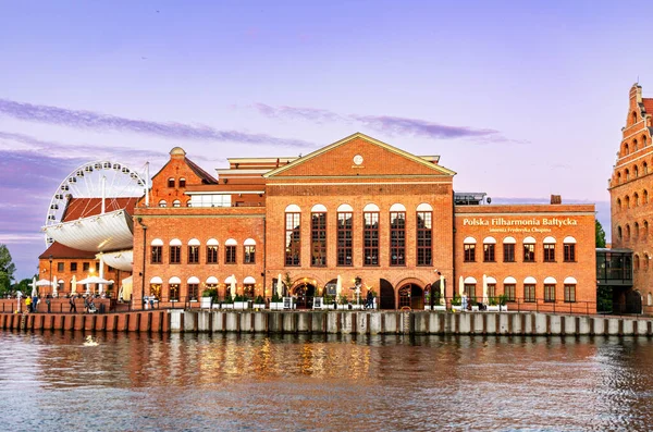 stock image Gdansk, Poland - June 24, 2022: building of the Polish Baltic Philharmonic named after Frederic Chopin on the embankment of the Motawa River in Gdansk. Popular tourist attraction