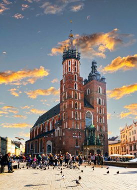 Krakow, Poland - November 12, 2022: Bazylika Mariacka, Saint Mary's Basilica, a brick gothic church, built in the 14th century on the Main Market Square in Krakw clipart