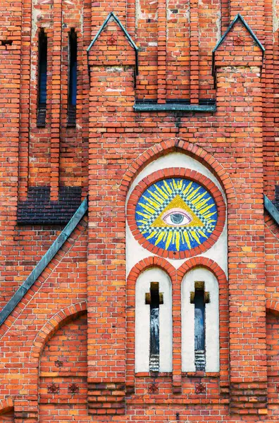 Mysterious eye in the triangle on the facade of the ancient church