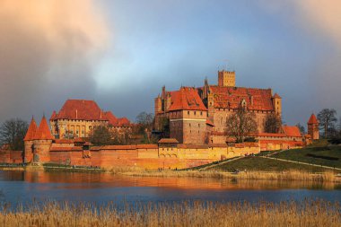 Malbork, Poland - March 02, 2024: Medieval capital of the Teutonic Knights, gothic brick castle Malbork in Poland. Popular tourist attraction and UNESCO heritage site clipart