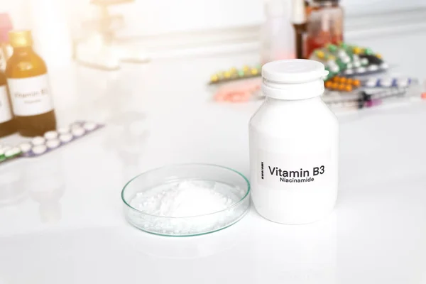 Vitamin B3 pills in a bottle, food supplement for health or used to treat disease