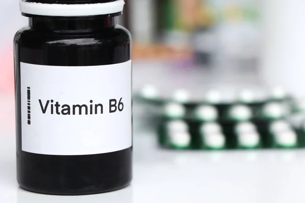 Vitamin B6 pills in a bottle, food supplement for health or used to treat disease