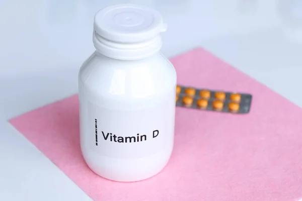 Vitamin D pills in a bottle, food supplement for health or used to treat disease