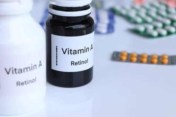 Vitamin A pills in a bottle, food supplement for health or used to treat disease