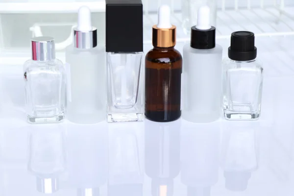 Beauty product bottle or serum bottle on white background, skin care products
