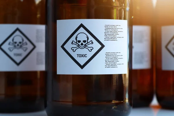 The toxic chemical symbol on the bottle, dangerous chemicals in industry or laboratory