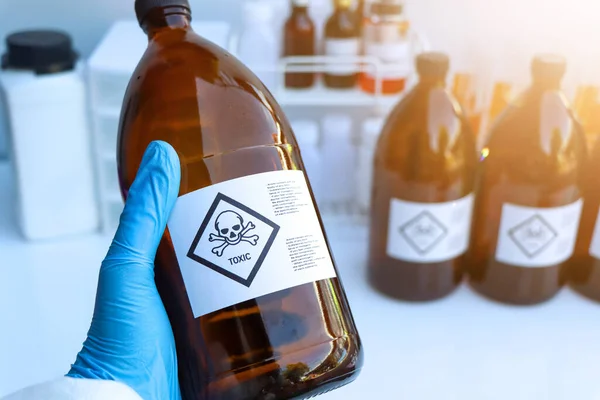 The toxic chemical symbol on the bottle, dangerous chemicals in industry or laboratory