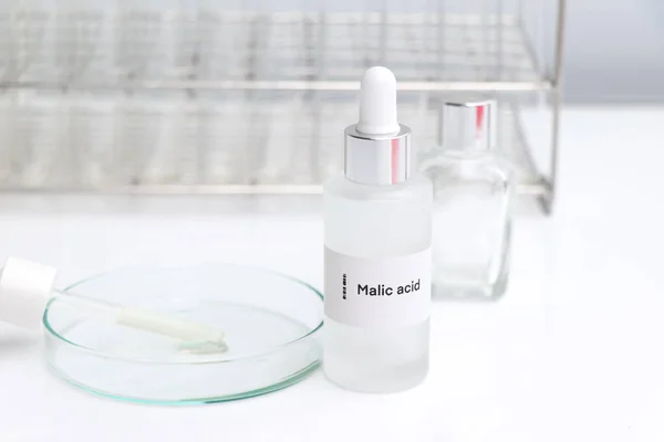 Malic acid in a bottle, chemical ingredient in beauty product, skin care products