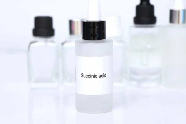 Succinic acid in a bottle, chemical ingredient in beauty product, skin care products