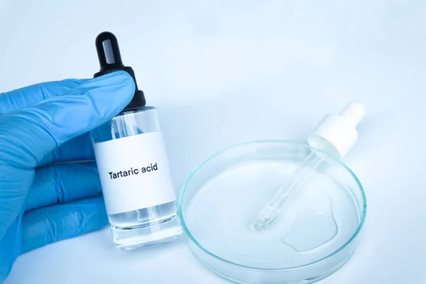 Tartaric acid in a bottle, chemical ingredient in beauty product, skin care products