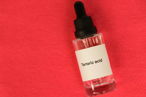 Tartaric acid in a bottle, chemical ingredient in beauty product, skin care products