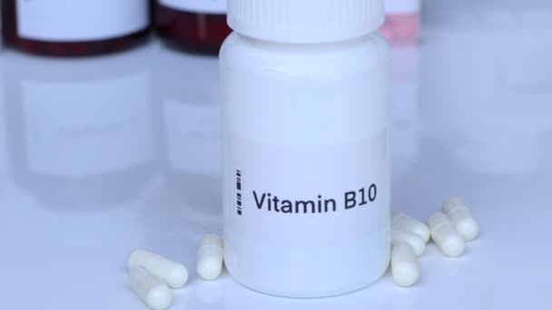 Vitamine B10 Pillen Een Fles Voedingssupplement Voor Gezondheid Gebruikt Voor — Stockvideo