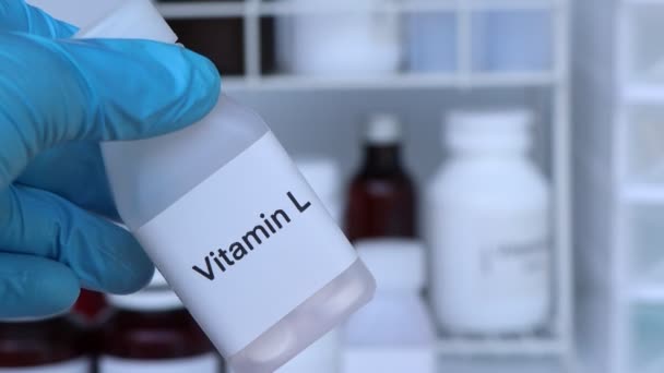 瓶内ビタミンL薬 健康のための食品サプリメントや病気を治療するために使用 — ストック動画