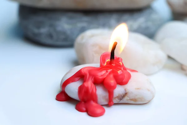 Candle light in the day, Candle light on white background and stone