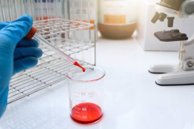 Red chemical in glass , chemical in the laboratory and industry, Chemical used in the analysis