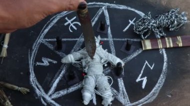 magic doll and White occult symbol on the witchcraft blackboard photo