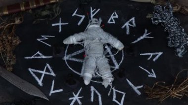 magic doll and White occult symbol on the witchcraft blackboard photo