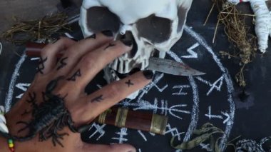 magic doll and White occult symbol on the witchcraft blackboard photo