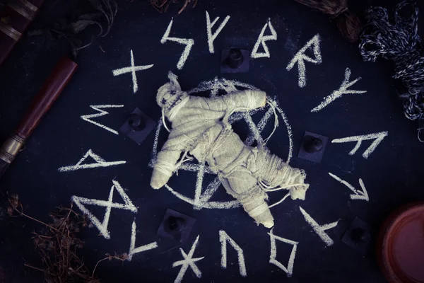 magic doll and White occult symbol on the witchcraft blackboard photo, religion and belief