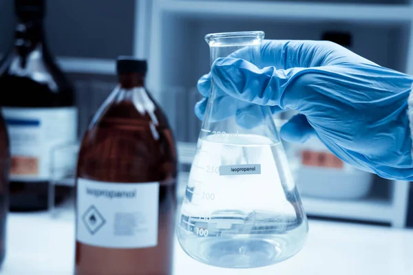 Stock image Isopropanol in glass, Hazardous chemicals in industry or laboratory 