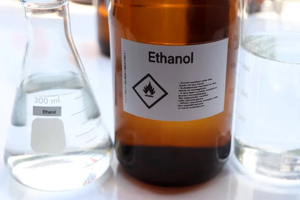 Ethanol in glass,Hazardous chemicals and symbols on containers in industry or laboratory